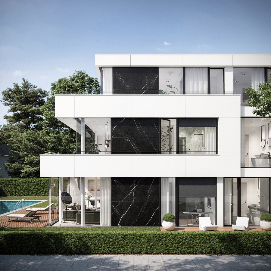 a modern apartment building in Munich with a black stone on the facade